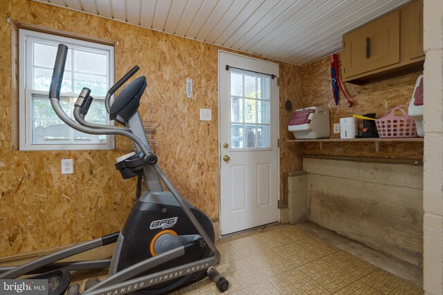 workout room featuring wooden ceiling