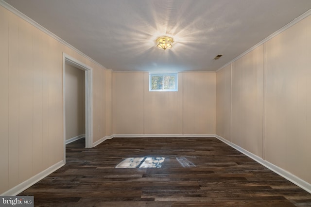 unfurnished room with dark hardwood / wood-style floors and crown molding