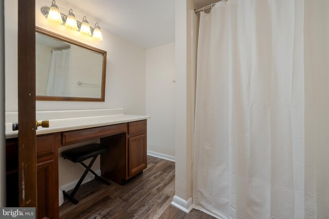 bathroom featuring hardwood / wood-style floors and vanity