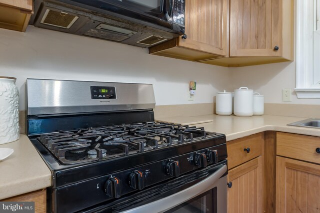 kitchen featuring stainless steel gas range oven