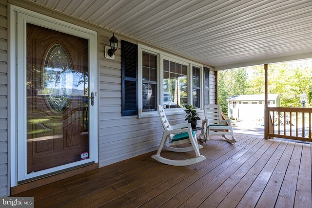 wooden terrace with covered porch