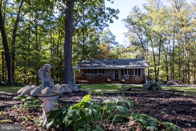 single story home with a wooden deck