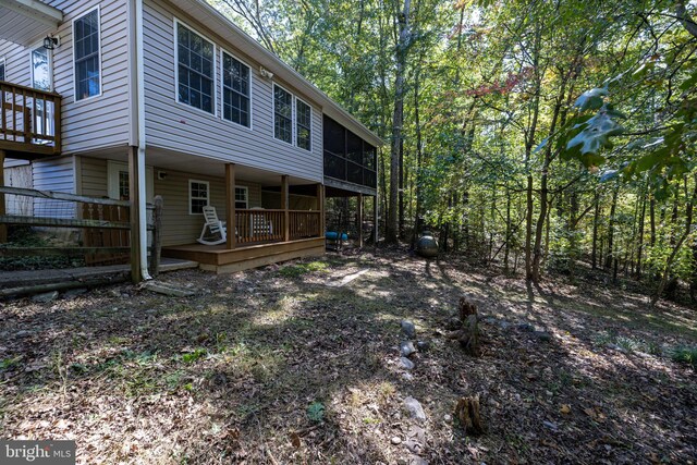 rear view of house with a sunroom