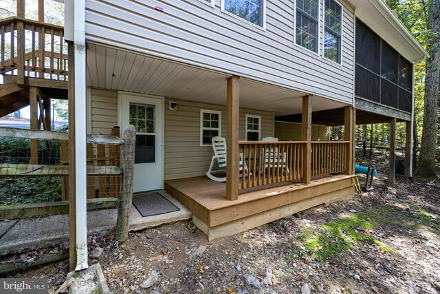 wooden terrace with a sunroom