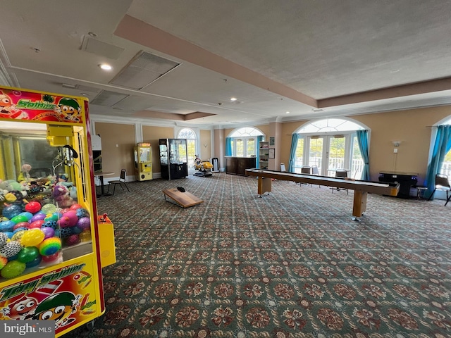 game room with carpet floors, french doors, and a raised ceiling