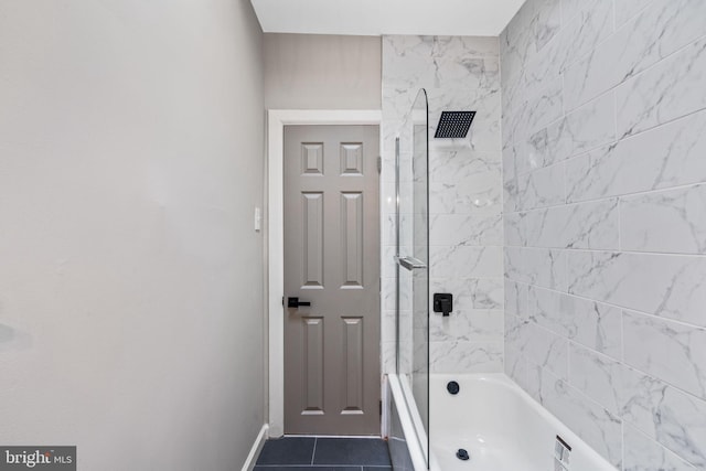 bathroom featuring tiled shower / bath combo and tile patterned floors