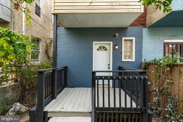 entrance to property with a deck