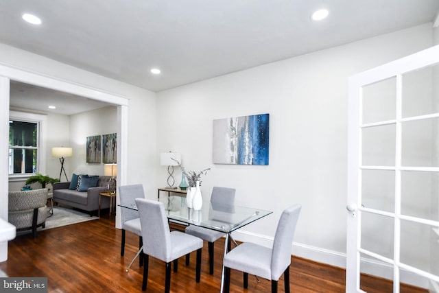 dining area with dark hardwood / wood-style floors