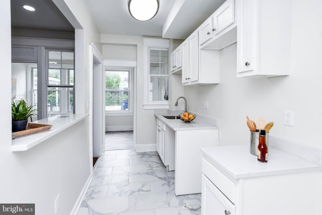 kitchen with sink and white cabinets