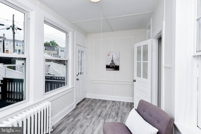 sunroom / solarium featuring radiator