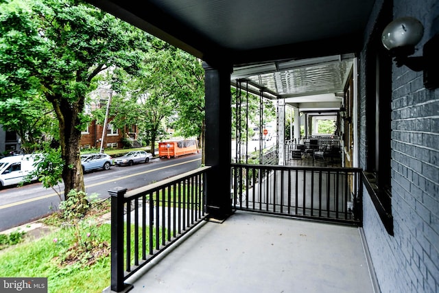 balcony featuring a porch