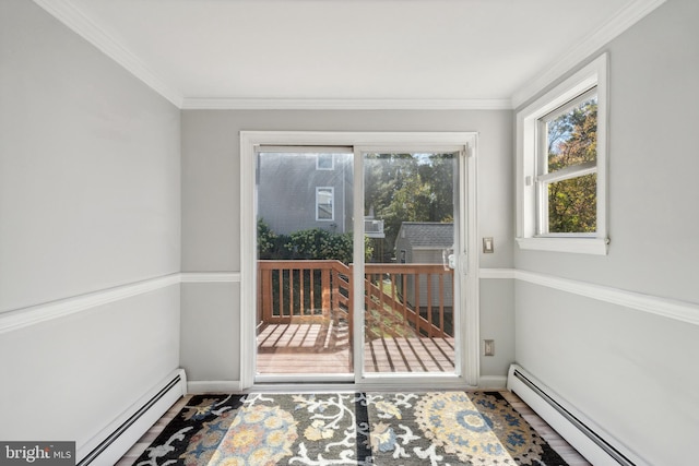 entryway with hardwood / wood-style flooring, ornamental molding, and a baseboard heating unit