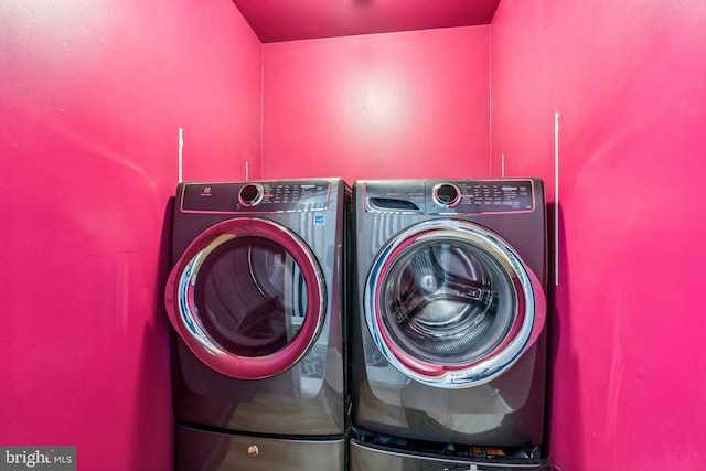 laundry room with washer and dryer