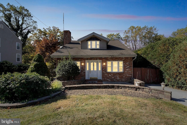 view of front of home featuring a yard