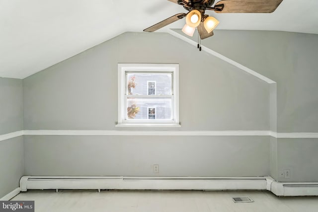 additional living space with ceiling fan, a baseboard radiator, and vaulted ceiling