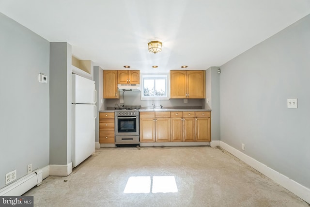 kitchen featuring stainless steel range with gas cooktop, sink, white fridge, and a baseboard radiator