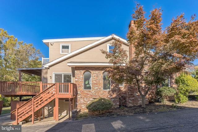 view of front of home with a wooden deck