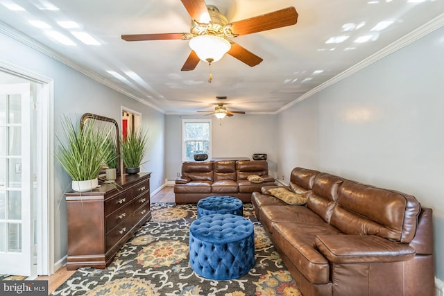 living room featuring ceiling fan, wood-type flooring, and ornamental molding