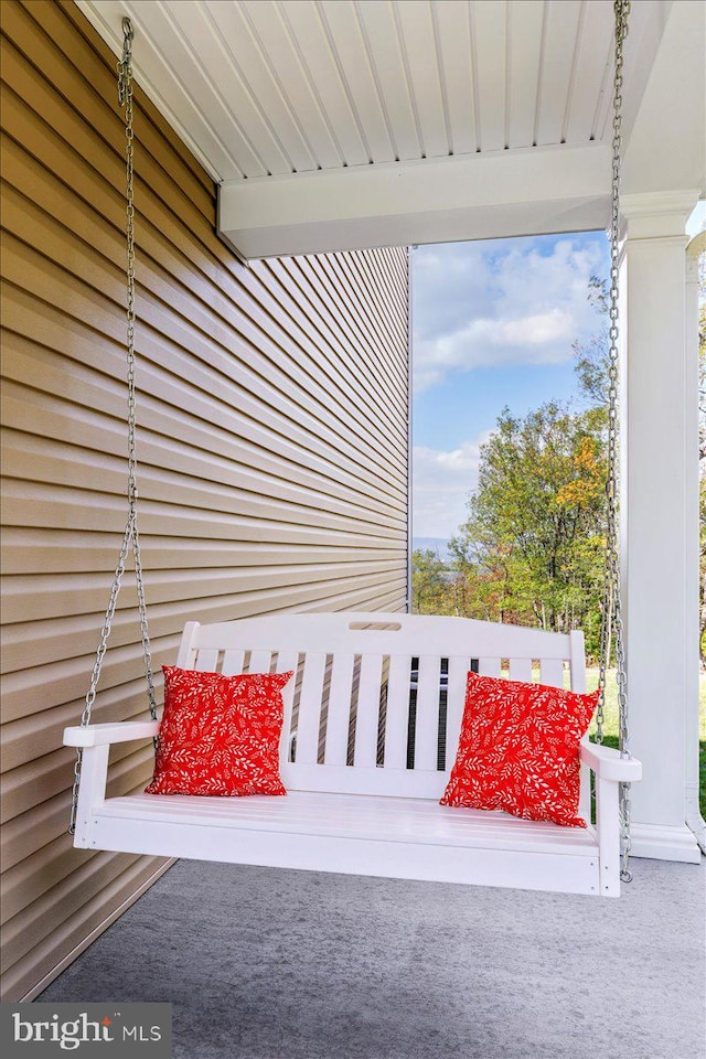 exterior details with carpet floors and beamed ceiling