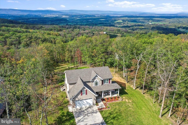 birds eye view of property featuring a mountain view