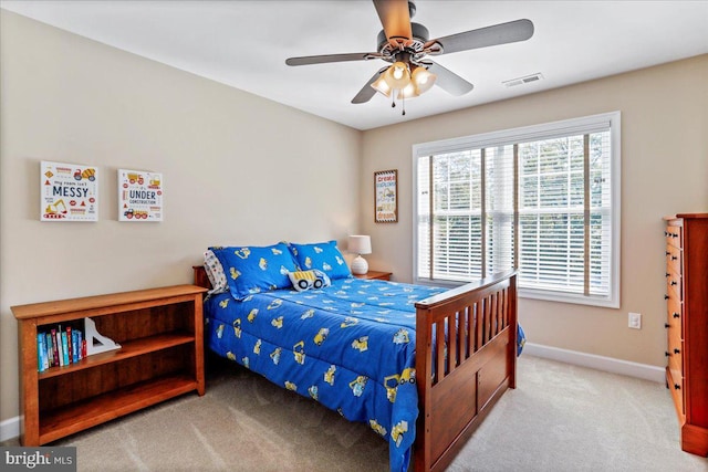 carpeted bedroom with ceiling fan