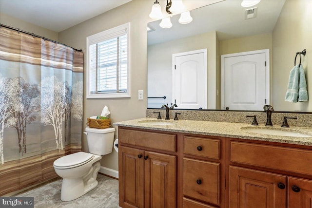 bathroom with walk in shower, tile patterned flooring, vanity, and toilet