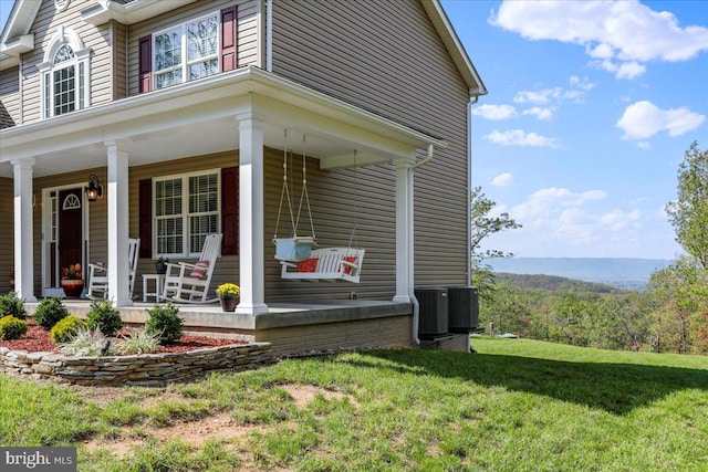 view of property exterior with a porch and a yard