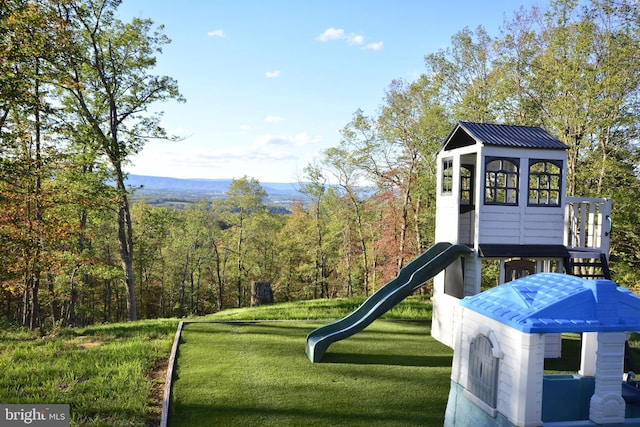 view of playground featuring a yard