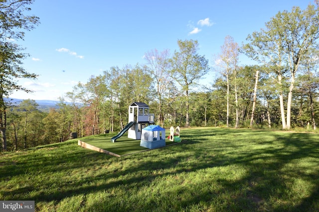 view of playground featuring a lawn