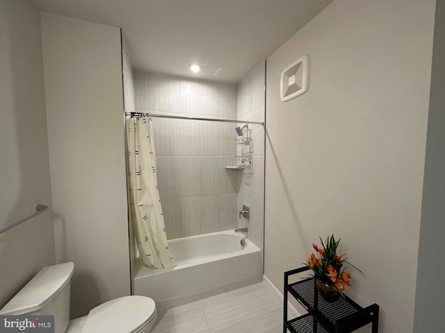 bathroom with toilet, shower / bath combo with shower curtain, and tile patterned flooring