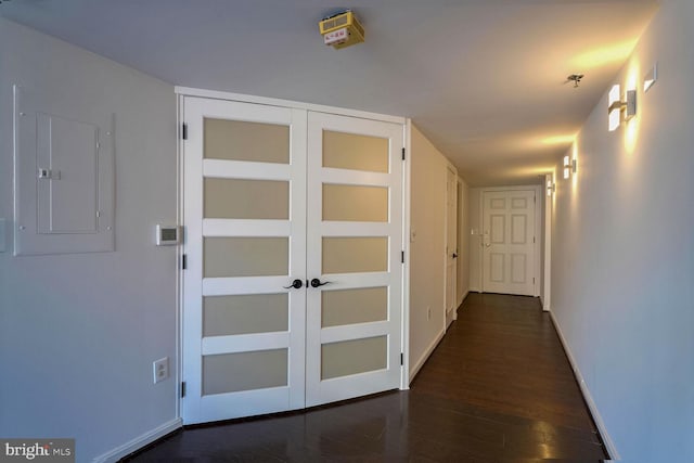 hallway with electric panel and dark hardwood / wood-style floors