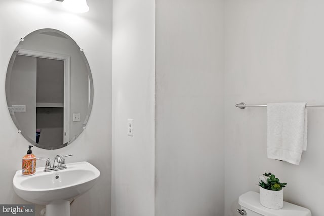 bathroom with toilet and sink