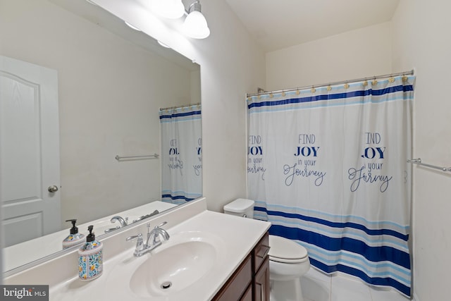 bathroom featuring toilet, vanity, and a shower with shower curtain