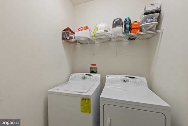 laundry room with washing machine and dryer