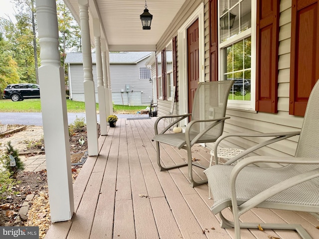 wooden terrace featuring a porch