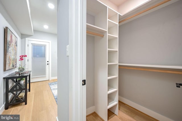 interior space featuring built in desk and light hardwood / wood-style floors