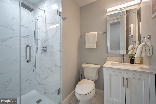 bathroom with toilet, an enclosed shower, and vanity