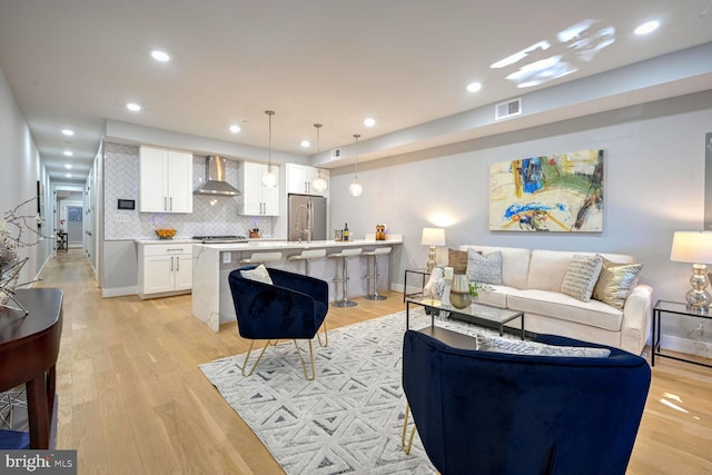 living room with light hardwood / wood-style floors