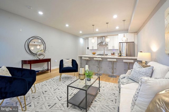 living room with light hardwood / wood-style flooring