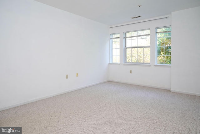 spare room featuring carpet