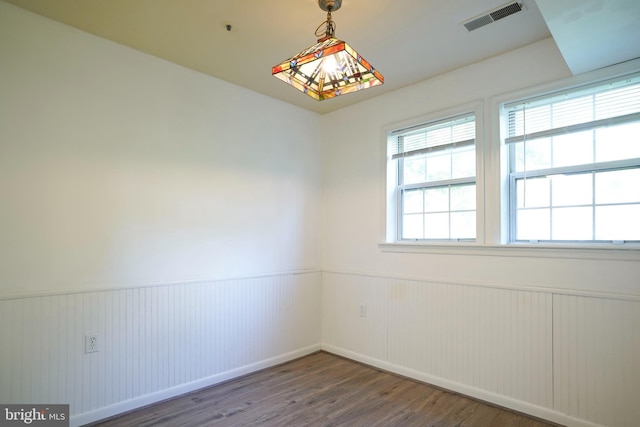 spare room featuring dark hardwood / wood-style floors