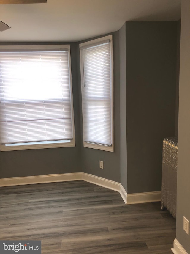 spare room featuring dark hardwood / wood-style floors