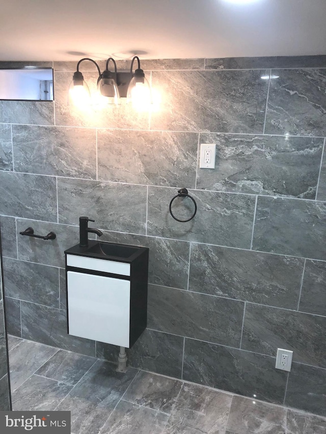 bathroom with tile walls