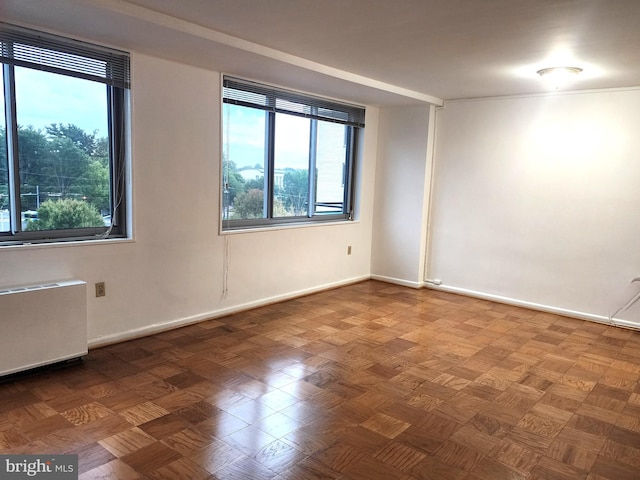 spare room with radiator heating unit