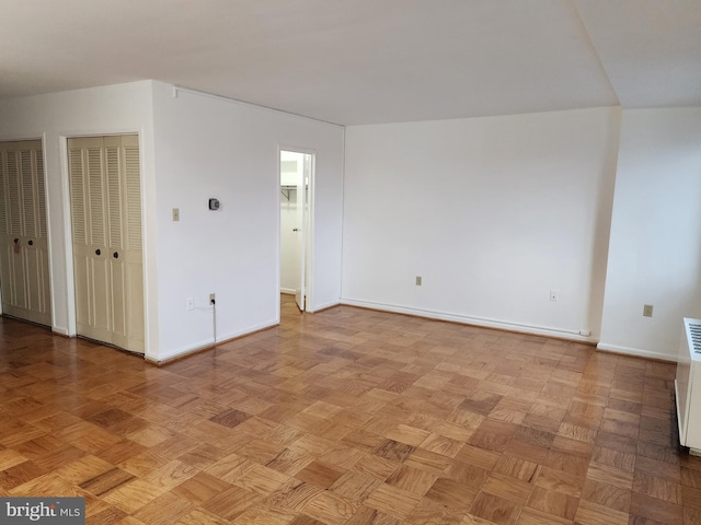 spare room featuring light parquet flooring