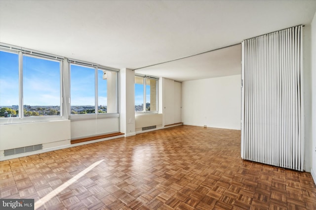 empty room featuring dark parquet floors