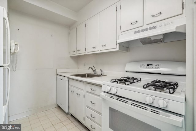 kitchen featuring white cabinetry, sink, light tile patterned floors, and white appliances