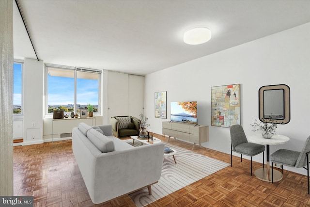 living room featuring parquet floors