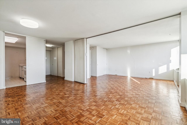 basement featuring light parquet flooring