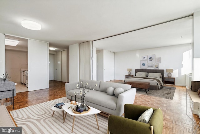 living room featuring parquet flooring